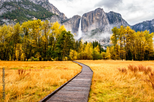Meadow with boardwalk in Yosemite National Park Valley at autumn photo