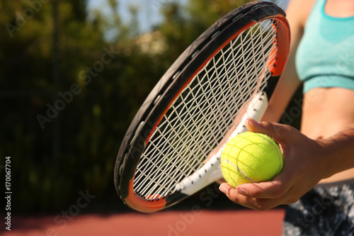 Young woman playing tennis, closeup © Africa Studio