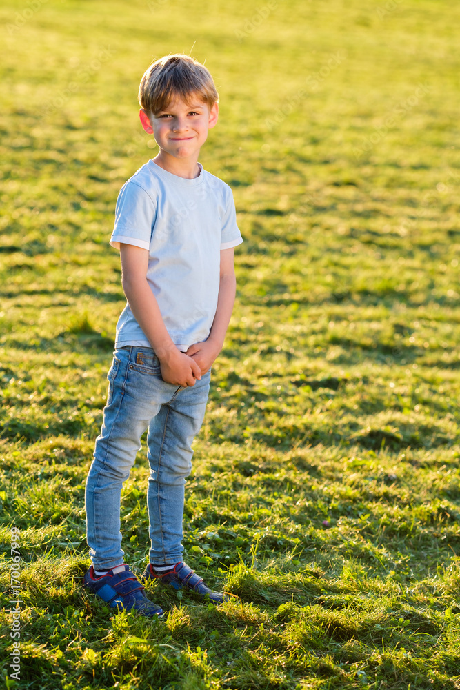 Little boy outdoors smiling in the park Little boy outdoors smiling in the park
