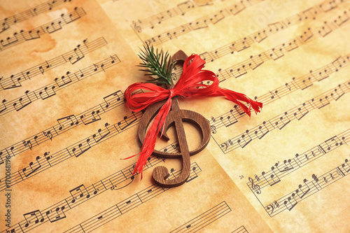 Wooden treble clef on music...