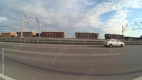 Wallpaper Mural timelapse traffic auto and a freight train ride over the bridge in the sunny daytime. Torontodigital.ca