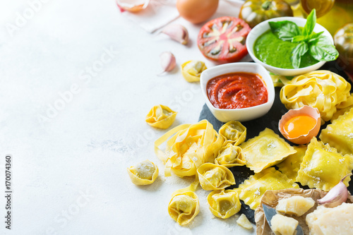 Italian food and ingredients  ravioli pasta spaghetti pesto tomato sauce