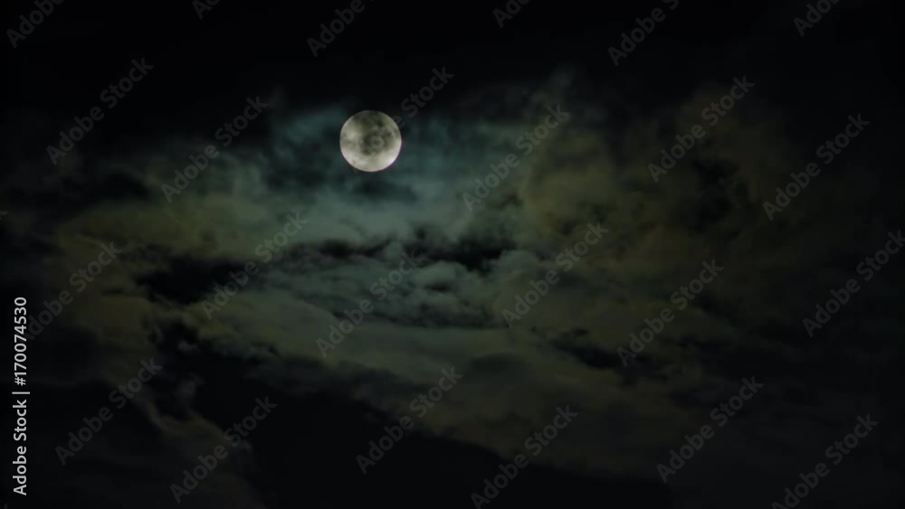 New moon and clouds in the pitchblack sky. Long shot New moon and clouds in the pitchblack sky. Long shot