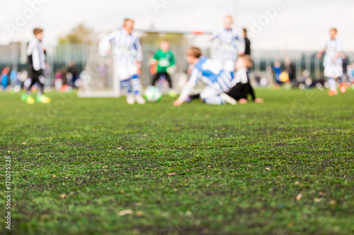 Blur of young boys playing soccer match