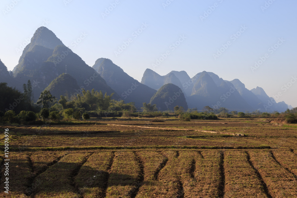 Landscape of Yangshuo. Farmland and Karst mountains. Located near Yangshuo County, Guilin City, Guangxi Province, China.