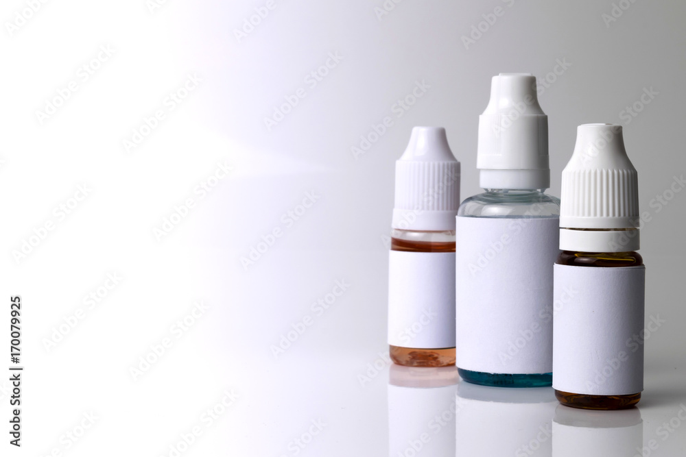 Isolated e liquid bottles for vape devices on a white background Isolated e liquid bottles for vape devices on a white background