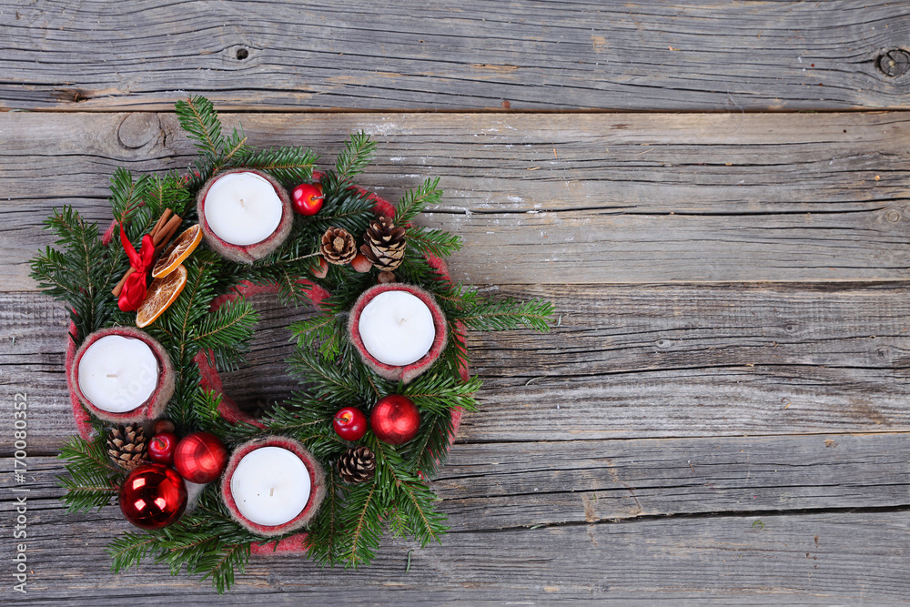 Christmas wreath with candles on wooden background Christmas wreath with candles on wooden background