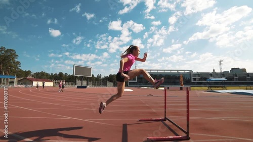 Professional female hurdler during training