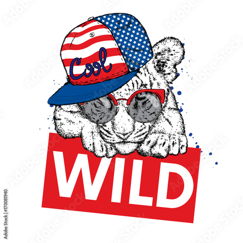 Fototapeta Naklejka Na Ścianę i Meble -  A beautiful tiger cub with glasses and a cap. Vector illustration for a postcard or a poster, print for clothes and accessories. Wild tiger. Fashion & Style. American flag. The Patriot of the USA.