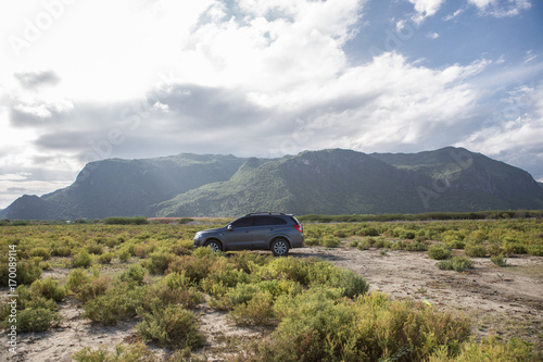 Private car test drive, Gray color Chevrolet Captiva Photo on country road in sunset time at 300 Yod Mountain,Thailand