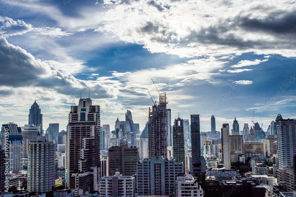 Obraz premium city buildings with shining cloud