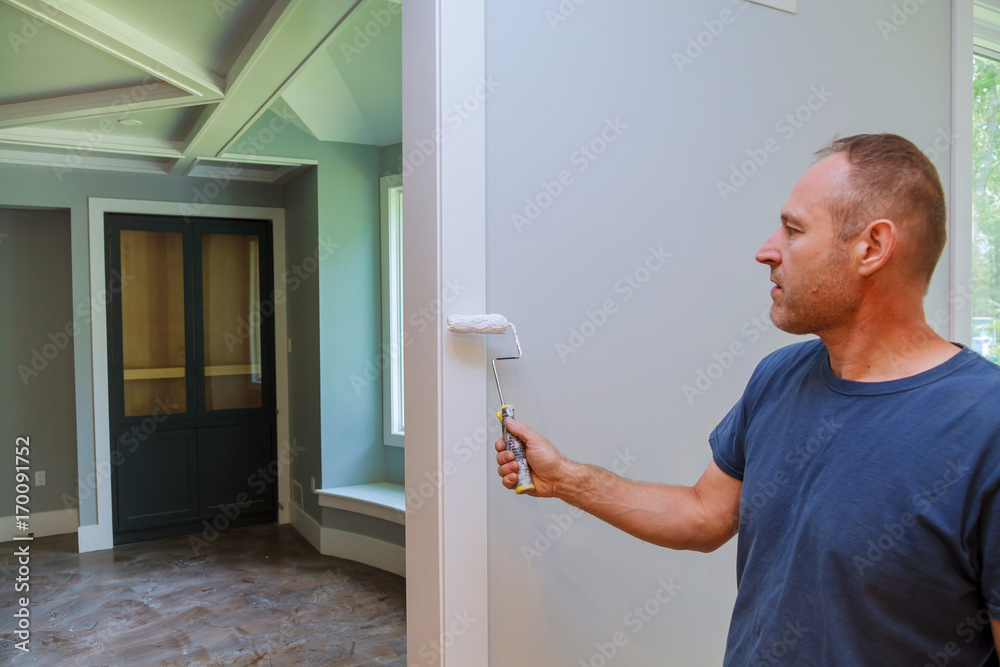 The master paints wooden moldings The master paints wooden moldings