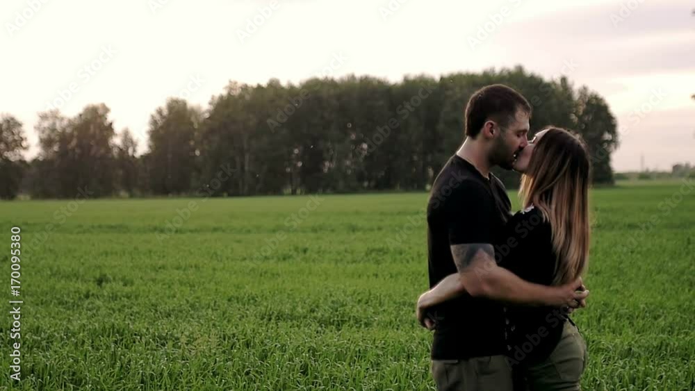 Young couple hugging and kissing slow motion Young couple hugging and kissing slow motion