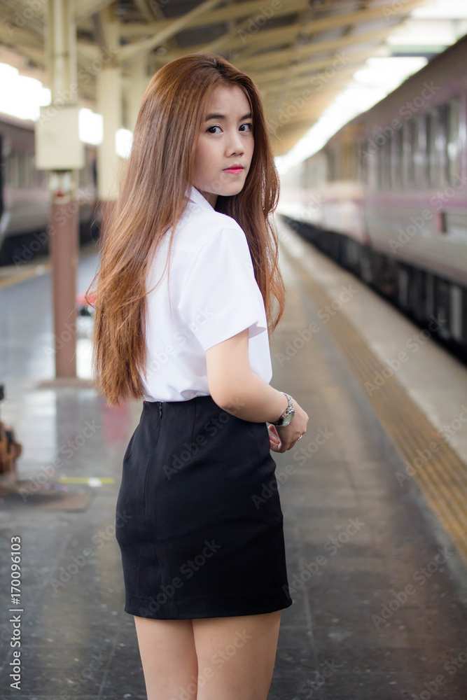 Portrait of thai adult student university uniform beautiful girl relax and smile