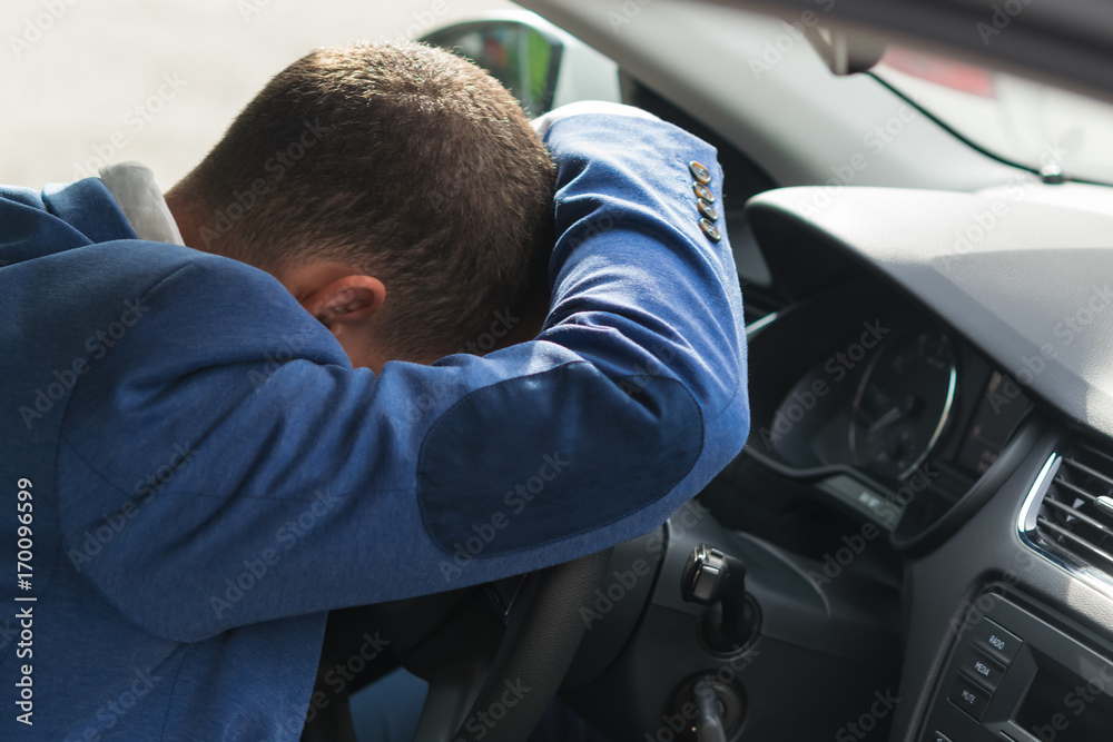 the driver fell asleep at the wheel of the car with a long trip creating a threat on the road the driver fell asleep at the wheel of the car with a long trip creating a threat on the road