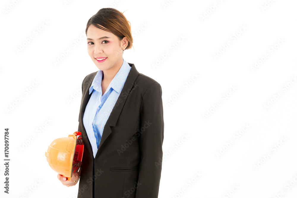 Young attractive confident asian woman, orange safety hat, glass, black suit, blue shirt on white background holding helmet.