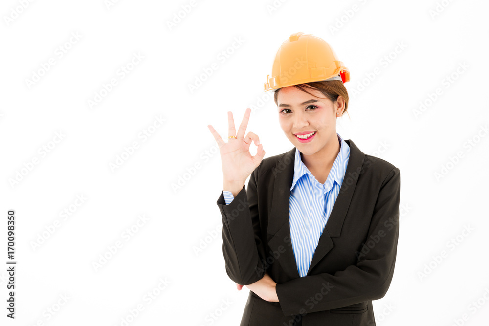 Young confident asian woman, orange safety hat, black suit, blue shirt on white posing okay sign. Young confident asian woman, orange safety hat, black suit, blue shirt on white posing okay sign.