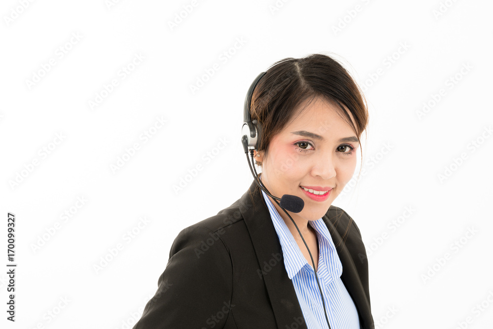 Young attractive confident Asian female business woman in suit blue shirt with headset on white background. Young attractive confident Asian female business woman in suit blue shirt with headset on white background.