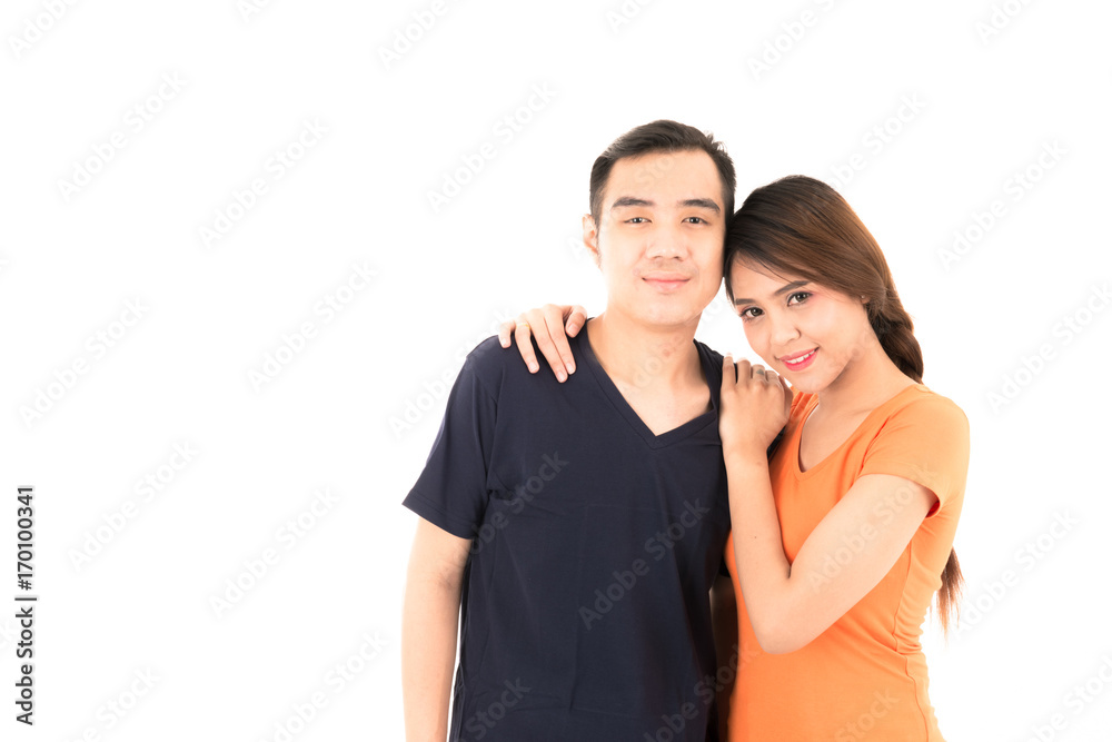 Young confident attractive Asian blue shirt man and orange woman lover couple loving portrait on white background. Young confident attractive Asian blue shirt man and orange woman lover couple loving portrait on white background.