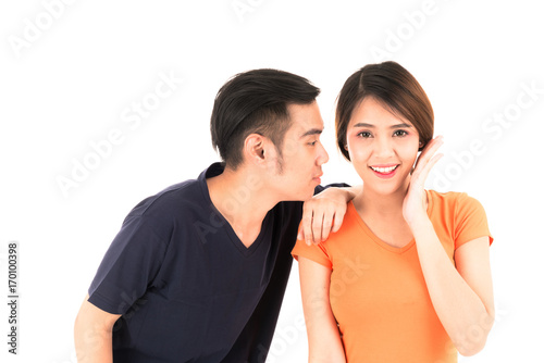 Young confident attractive Asian blue shirt man and orange woman lover couple loving portrait on white background.