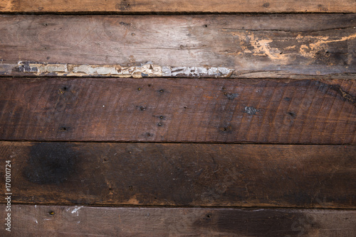 Close up top down view of wood texture of old wood use as natural background with applied vintage retro filter effect.
