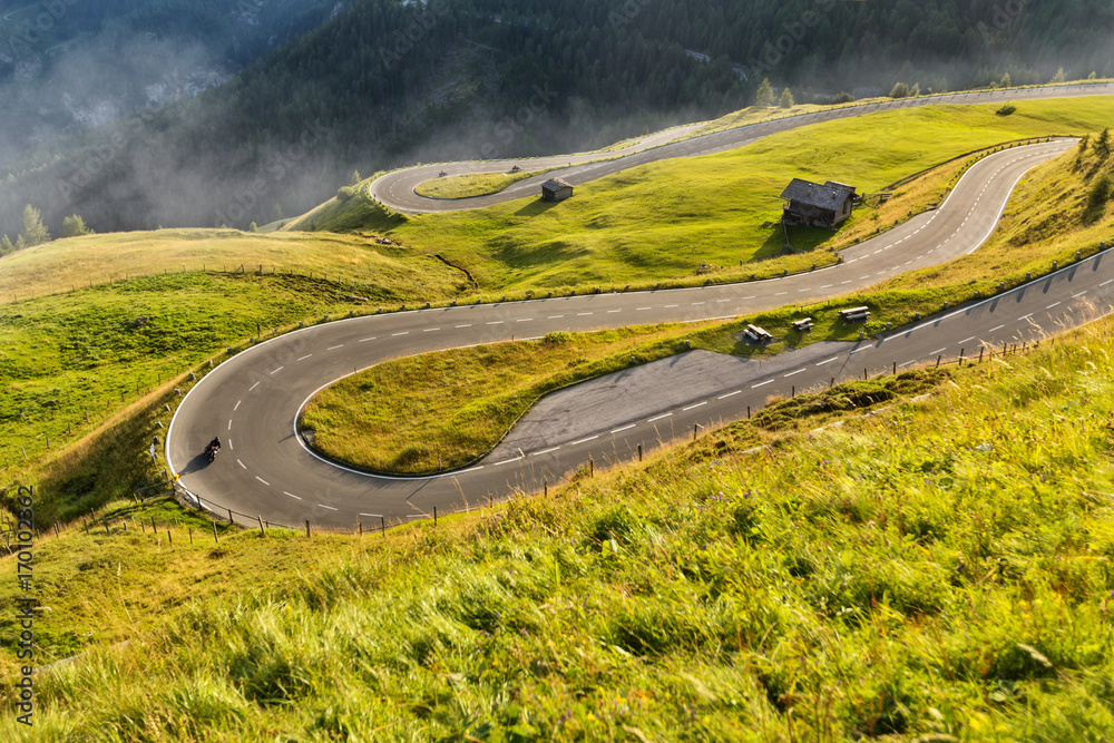 Fototapeta premium Motorcycle drivers riding in Alpine highway. Outdoor photography