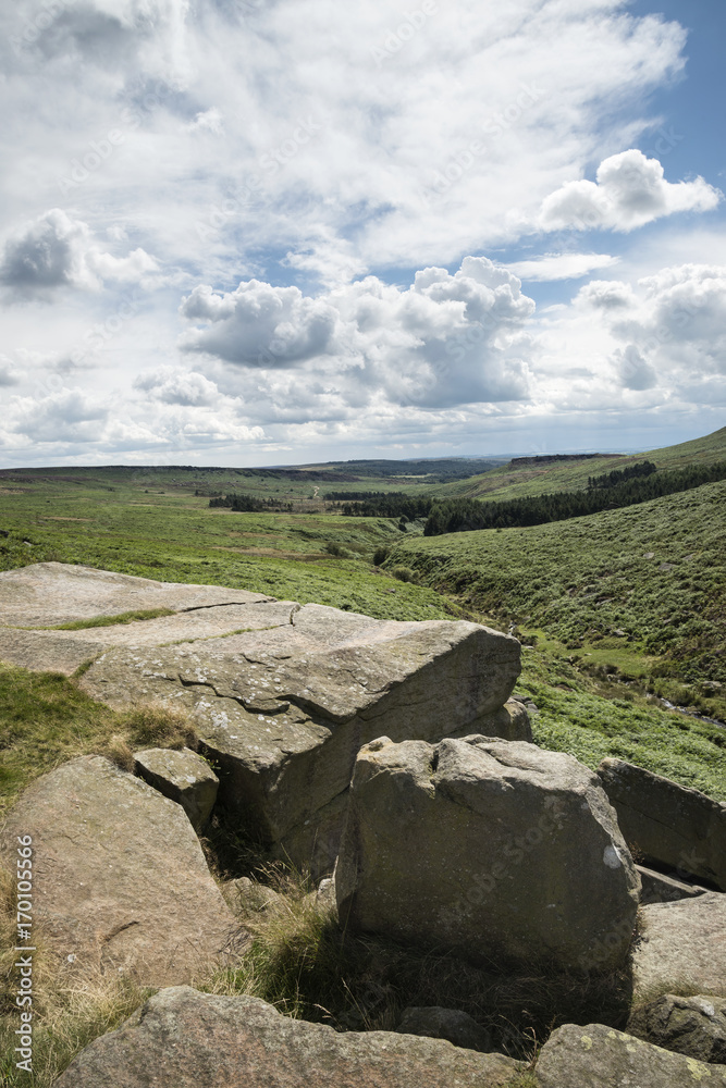 Beautiful vibrant landscape image of Burbage Edge and Rocks in Summer in Peak District England Beautiful vibrant landscape image of Burbage Edge and Rocks in Summer in Peak District England