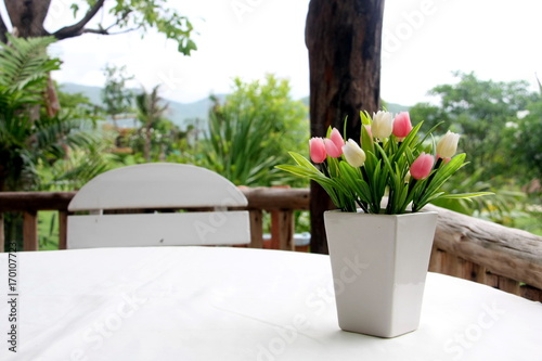Flowers Cup on the table. with a garden view
