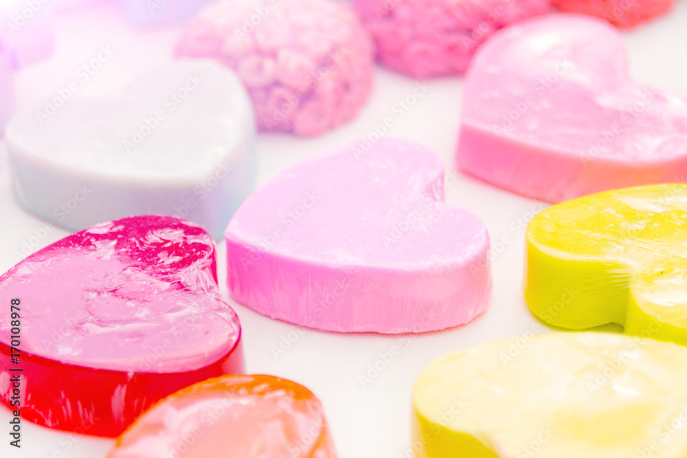 photo handmade soap in the form of sweets, heart, canteen, fruit, in boxes on the table close-up as background under the inscription photo handmade soap in the form of sweets, heart, canteen, fruit, in boxes on the table close-up as background under the inscription