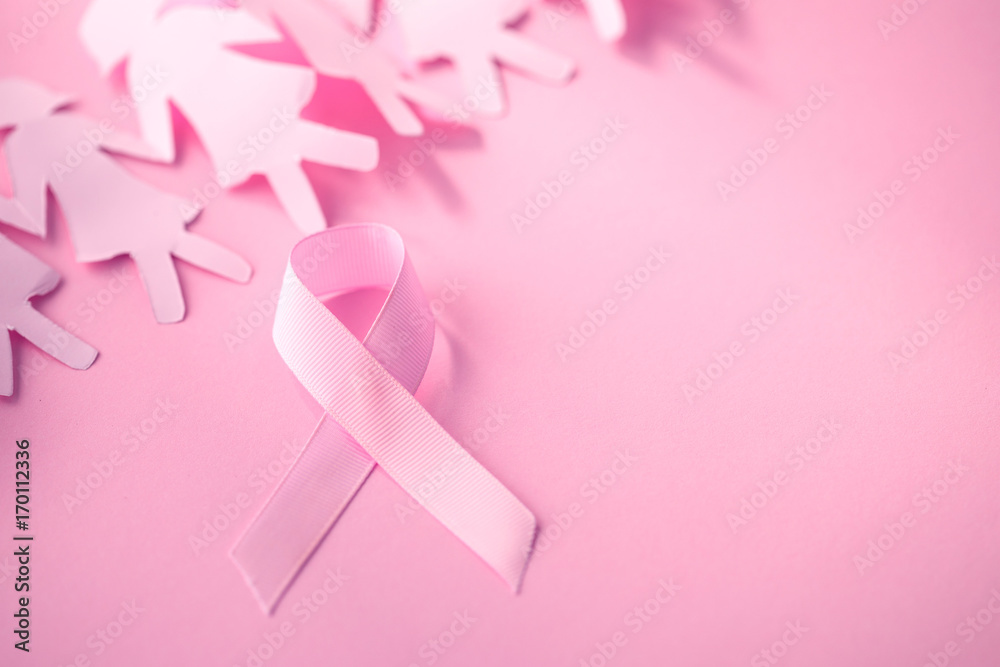 The Sweet pink ribbon shape with girl paper doll on pink background  for Breast Cancer Awareness symbol to promote  in october month campaign