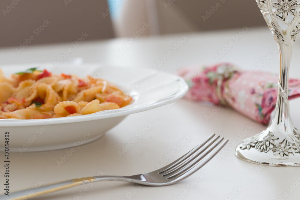 Pasta served with a goblet of wine Pasta served with a goblet of wine