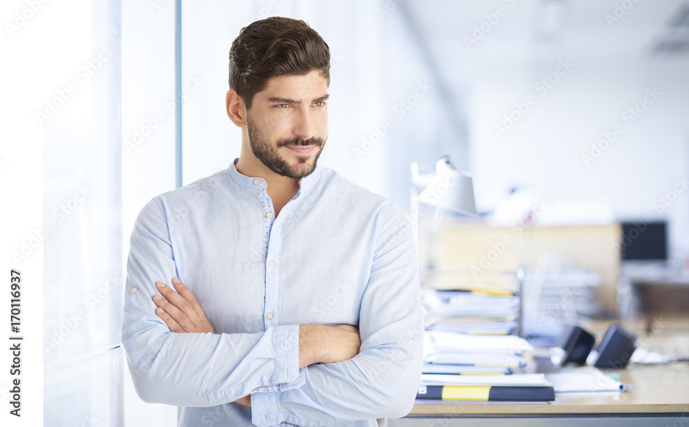 Professional businessman at the office. Portrait of a young marketing director Professional businessman at the office. Portrait of a young marketing director