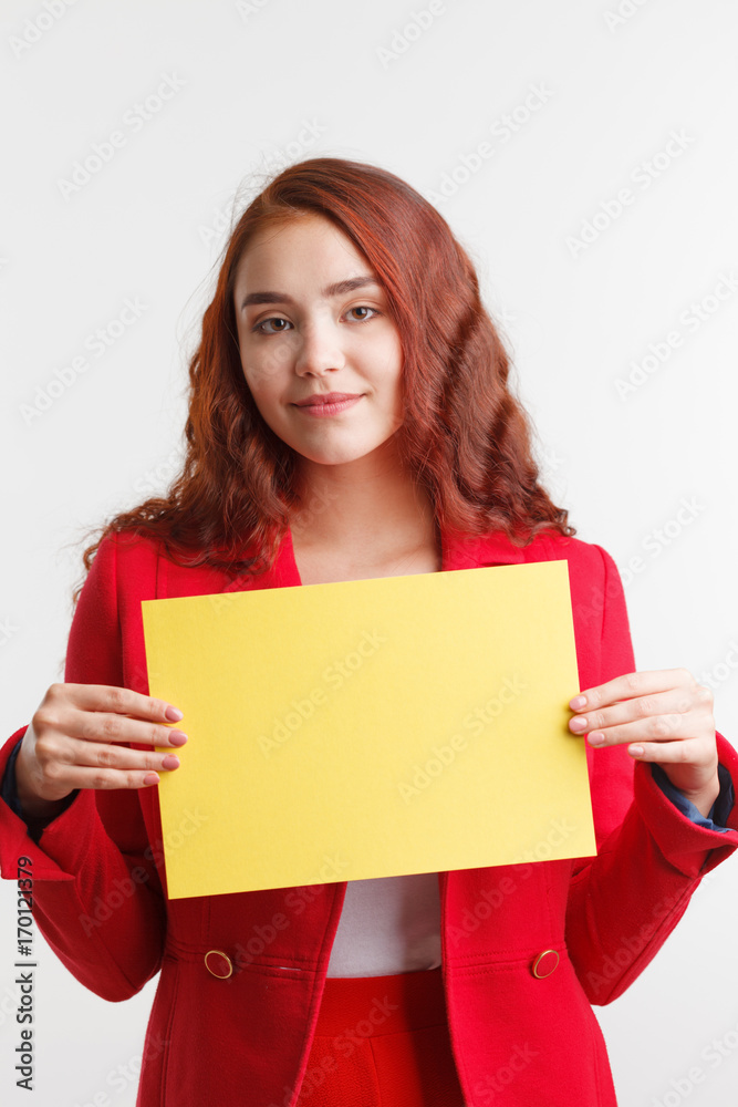 Businesswoman showing signboard, studio on white background. Businesswoman showing signboard, studio on white background.
