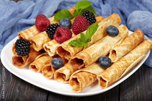 Delicious waffle rolls with berries