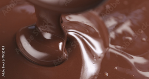 pouring melted premium dark chocolate