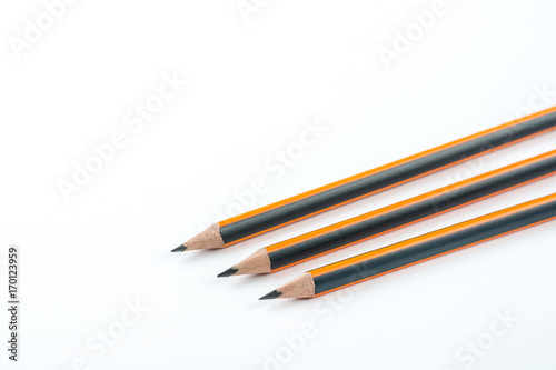 Graphite wooden pencils isolated over white background with copy