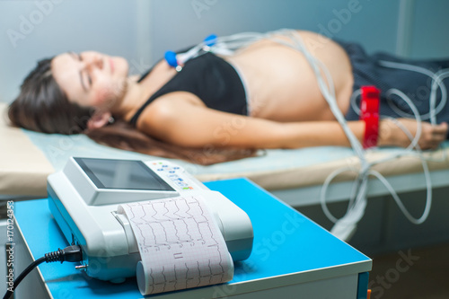 Foto Electrocardiogram, cardiac cardiograph and conduct research,