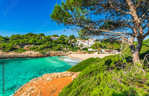 Beautiful view of mediterranean bay beach with turquoise sea water at Cala Anguila, Majorca Spain