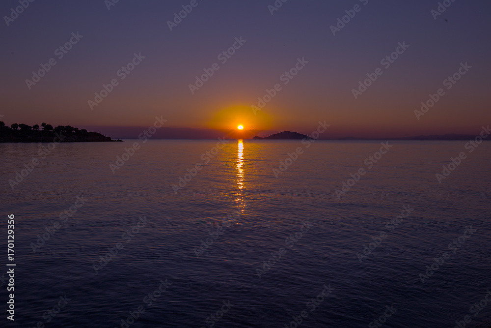 Sea view from beach with sundown  sky.Summer rest on the beach of Greece.