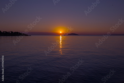 Sea view from beach with sundown  sky.Summer rest on the beach of Greece.