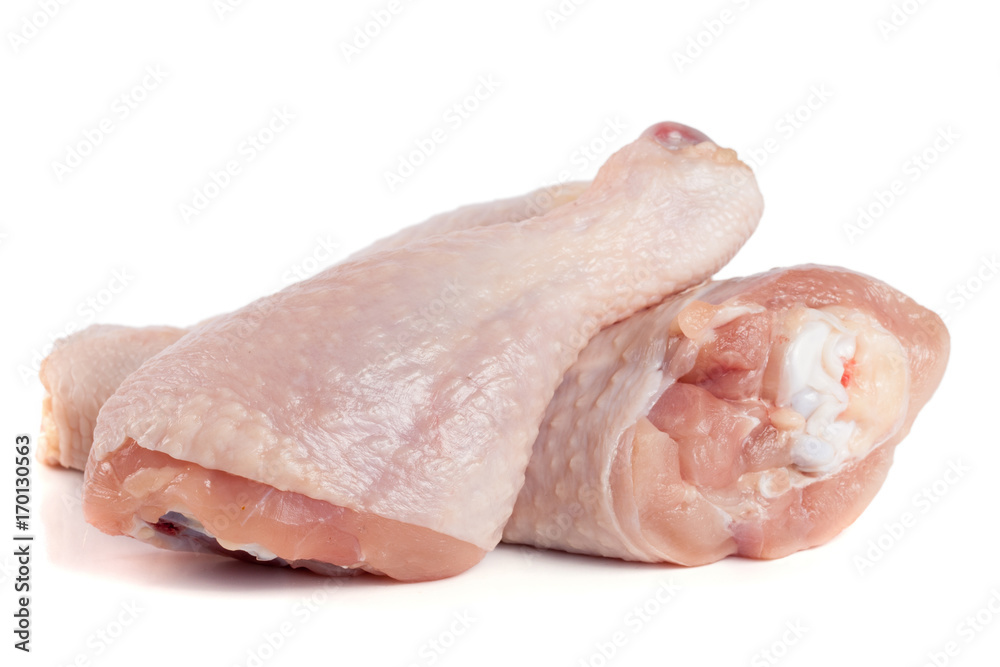 Two raw chicken drumsticks isolated on white background Two raw chicken drumsticks isolated on white background