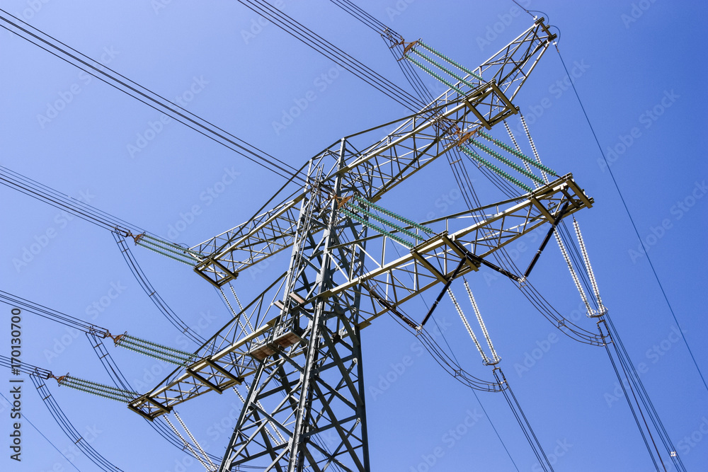 Power lines hanging on a pylon. Typical Dutch energy infrastructure