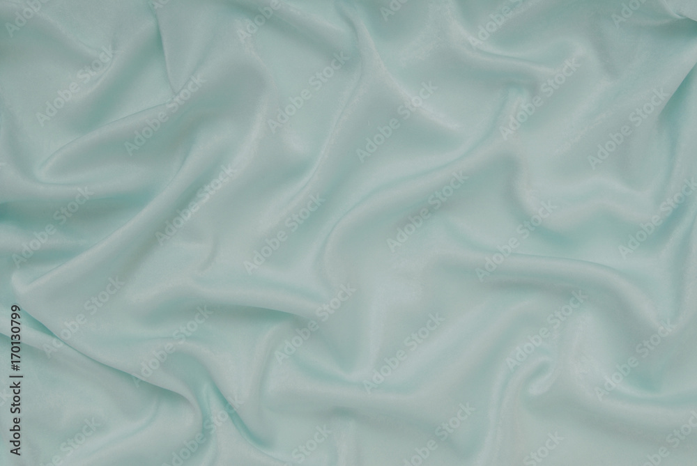 Naklejka premium light turquoise satin material, blue sateen fabric, silk textile, beautiful creative background
