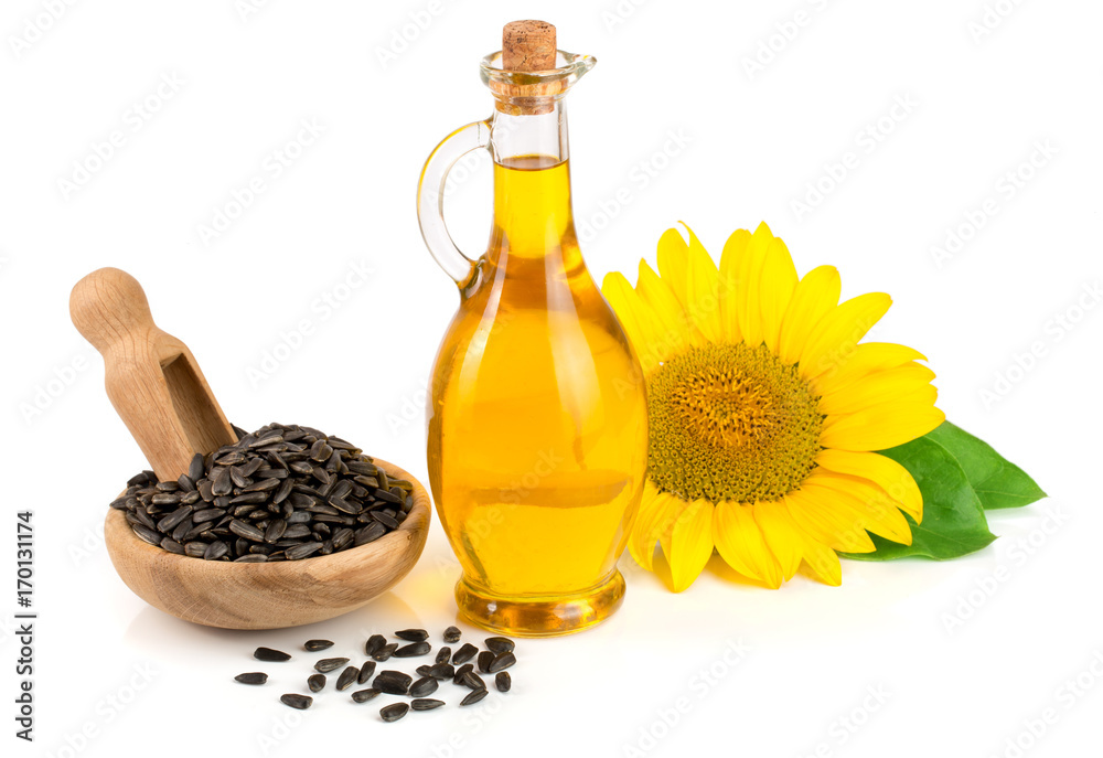 Sunflower oil, seeds and flower isolated on white background Sunflower oil, seeds and flower isolated on white background