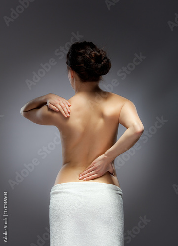 Woman massaging pain back