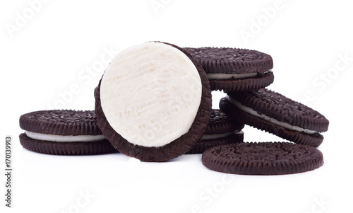 Chocolate cookies with cream filling tower isolated on white background.