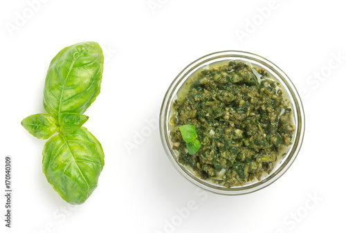 pesto sauce in bowl isolated on white