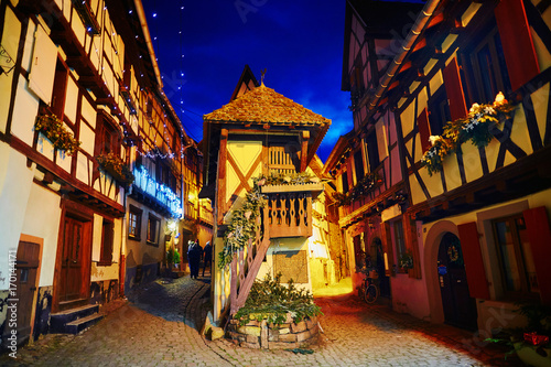 Narrow streets of Eguisheim, Alsace, France decorated for Christmas