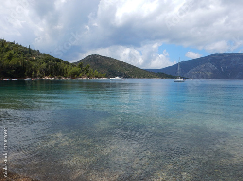 The bay of Skinos with green and turquoise sea in Ithaka or Ithaca island in Greece. photo