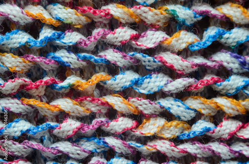 Multi-colored knitted fabric cozy texture background close-up © v_sot
